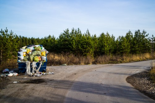 Operator performing risk assessment at a skip hire site